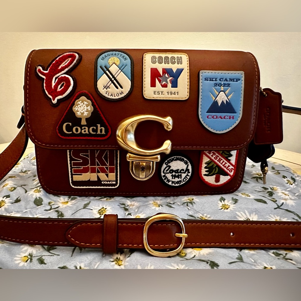 Coach crossbody purse with coach ski patches in cognac real leather